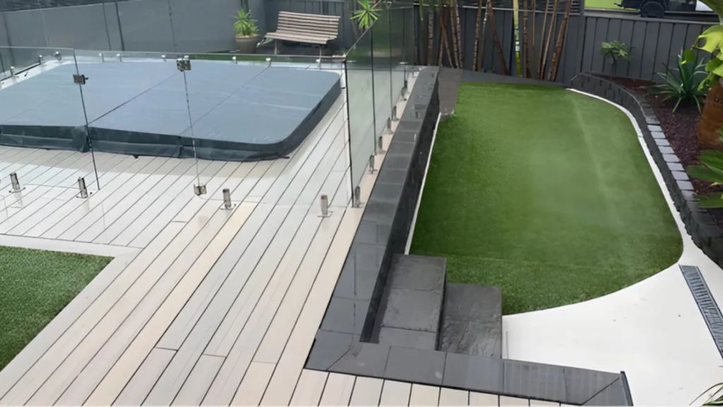 Modern outdoor spa pool in landscaped backyard